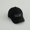 Detail of BAAF letter embroidery on black cotton baseball cap for kids with white outlines - 50-52cm (1-5 Years Old) / Black