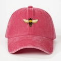Close-up of vintage washed pink cotton fabric and embroidered bee detail on baseball cap - One Size / Watermelon red