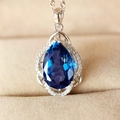 Silver pendant necklace featuring a large pear-cut deep blue gemstone with diamond halo - Sapphire Blue Diamond Luxury Necklace Xl-115