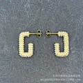 Detailed view of gold rectangle hoop earrings with pave-set shimmering crystals - G-Shape Full Star
