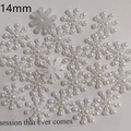 Close-up of 14mm white faux pearl snowflake flatback charms for DIY jewelry and nail art - 14mm Flatback Snowflake (No Hole)