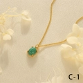 Detail of green malachite pendant in 18K gold plated claw setting on silk texture - Malachite
