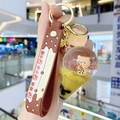 Brown silicone strap keychain featuring a liquid bear milk tea ice cream pendant - Pearl Milk Tea Bear-Ice Cream