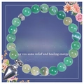 Detailed view of 8mm green agate stone bracelet with a heart charm on a gift card - Emerald Green (Style A)