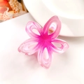 Macro shot of the gradient pink plumeria hair claw clip with golden metal spring detail - Hollow Frangipani Pink Purple