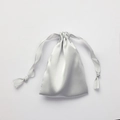 Silver satin drawstring pouch with a smooth silk-like finish and matching ribbon closure - Silver