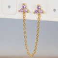 Macro detail of gold flower ear cuff with purple cubic zirconia and dangling chain - Gold Purple Rhinestone