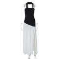 Detail of elegant black halter top with white pleated skirt and side slit on mannequin - Black & White / XS