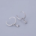 Detailed macro shot of S925 sterling silver hoop earrings with hand gesture charms - Rock Hand Earrings - Silver