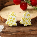 Elegant Christmas tree earrings in white and yellow acrylic with festive holiday background - White Yellow Pattern