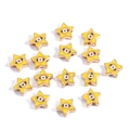 Macro shot of gold star evil eye charms with yellow enamel coating for jewelry making - Pentagram / Yellow