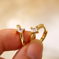 Minimalist golden hoop earrings featuring a square-cut clear zircon in a classic four-prong setting - Square Zirconia Prong Set Gold Huggie