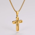 Detailed macro of gold stainless steel cross pendant with engraved Spanish prayer text - Gold