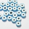 Macro shot of 10mm light blue evil eye polymer clay beads for DIY jewelry making - Light Blue