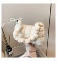 Detail of white quilted bubble handbag featuring pleated handle and drawstring bow - Off White