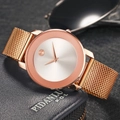 Slim rose gold minimalist mesh strap quartz watch for men displayed on a blue leather wallet - Rose Gold