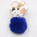 Detail of cute calico cat plush pompom keychain with golden metal ring and lobster clasp - Gold Buckle Cat / Sapphire Blue