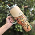 Light green stainless steel insulated tumbler with European town illustration and handle - 40oz / Moon Island Villa
