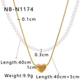 Double-layered gold necklace with pearl strand and heart pendant on white background - Heart Pendant Pearl Double Layer Style (NB-N1174)