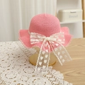 Detail of pink woven straw hat featuring a lace bow with heart prints on a gold stand - 52cm 3-6 Years / Lace Straw Hat - Peach Pink