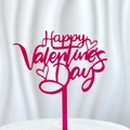Close-up of pink Happy Valentine's Day acrylic cake topper with cursive text and heart motifs - Valentine's Day Rose Red 1 (approx. 10.5cm Wide)
