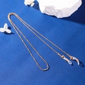 Golden beaded metal eyewear chain with silicone loops on a textured blue background - Style 01 / Gold