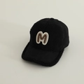 Detailed view of the warm lamb wool texture and M patch on this black kids baseball cap - 52-54cm 3-8 Years / Black