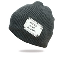 Dark grey chunky knit beanie with a vintage white patch label shown at a 45-degree angle - One Size / Dark Gray