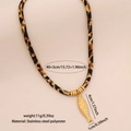 Collier en corde léopard avec pendentif poisson doré et détails en acier inoxydable - Acier Inoxydable/Polyester / Poisson