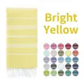 Detail view of bright yellow striped Turkish towel with white fringe and color palette - 90x180cm / Bright Yellow