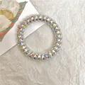 Transparent spiral phone cord hair tie with colorful star glitter inside and wavy shape - Glossy Star