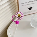 Pink silicone straw cover with a daisy smiley face on a glass straw in a white tray - 10mm-Individual Package / Sunflower Purple