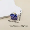 Detailed view of evil eye hair claw clip with blue eye pattern and silver metal spring - 2.5cm Cherry Style Eye Claw Clip