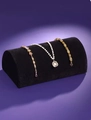 Black velvet semicircular jewelry display stand with pearl necklace and gold bracelets - Black