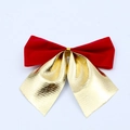 Detailed close-up of decorative red velvet and gold metallic Christmas tree bows - 8cm / Red and Gold