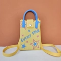 Detail of yellow knit phone bag with blue handles and Lucky Star embroidered text - Lucky Star (Yellow)