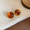 Maillard style amber resin round stud earrings with gold trim on beige fabric - 75# Silver Earring Post-Round-Gold-Brown-Spiral Edge