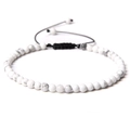 Close-up of 4mm white howlite stone beads with black adjustable braided nylon cord bracelet - White Howlite