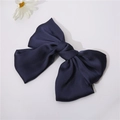 Detailed close-up of navy blue satin bow hair clip with layered fabric and smooth texture - Navy Blue