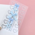 Detail of heart-shaped rhinestone stickers and blue fabric bows for facial makeup decoration - BJA-636 (Blue Heart Diamond Bow)