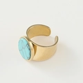 Detail view of gold wide band ring featuring turquoise stone with beaded edge detailing - Adjustable Open / Lake Blue Wide