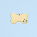 Close-up of golden bone-shaped pet tag with hollow paw print on blue background - Large (24*36mm) / 18K Gold