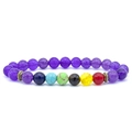 Macro shot of 7 chakra natural stone yoga bracelet with purple beads and bronze spacers - Purple Chalcedony Seven Chakra Bracelet