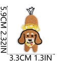 Embroidered brown sausage dog patch with yellow crown and detailed stitching - US 13