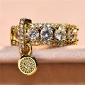 Elegant gold-plated ring with round cubic zirconia stones and a dangling charm pendant - US 4 / Gold