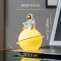 Astronaut on glowing yellow moon lamp with gold visor, 12cm height desktop decor - Gold Astronaut + Planet Lamp