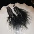Gothic style black feather tassel earrings with sparkling rhinestones and beaded details - Black Ear Clip