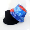 Detail view of foldable bucket hats in classic black and blue-red-white tie-dye print - Red Blue White Tie Dye
