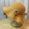 Detailed view of yellow woven sun hat featuring a pearl flower and rhinestone chain trim - Adult 54-60 Adjustable / Turmeric