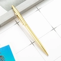 Elegant slim golden metal ballpoint pen with clip shown on a minimalist desktop setting - Sheaffer Style Electroplated Gold